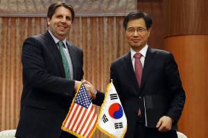 U.S. Ambassador to South Korea Mark Lippert and South Korean Ambassador for Nuclear Energy Cooperation Park Ro-byug after initialing a new nuclear-energy pact [Image Courtesy of WSJ]